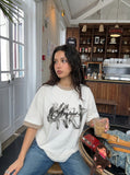 DAXUEN white oversized smoke graphic tee — model photo