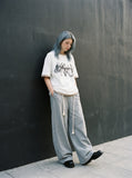 DAXUEN white oversized smoke graphic tee — model photo