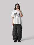 DAXUEN white oversized smoke graphic tee — model photo