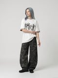 DAXUEN white oversized smoke graphic tee — model photo