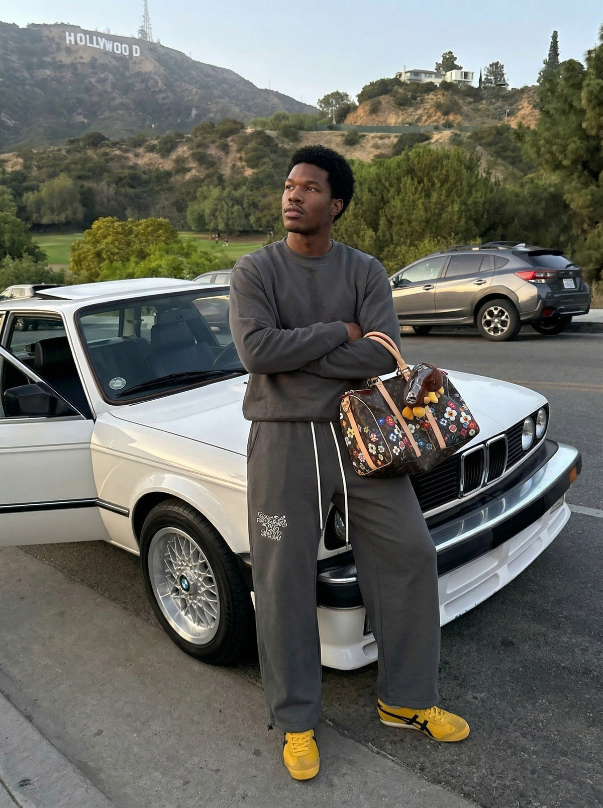DAXUEN Dark grey wide leg sweatpants with unique graphics — model photo