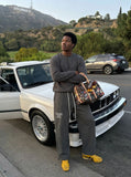 DAXUEN Dark grey wide leg sweatpants with unique graphics — model photo