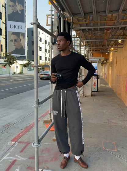 DAXUEN Dark grey wide leg sweatpants with unique graphics — model photo
