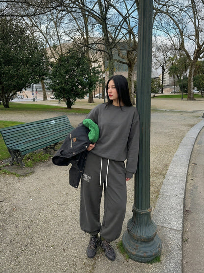 DAXUEN Dark grey wide leg sweatpants with unique graphics — model photo