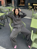 DAXUEN Dark grey wide leg sweatpants with unique graphics — model photo