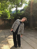 DAXUEN solid black wide-leg trousers — model photo