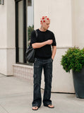 DAXUEN solid black crew neck knit t-shirt — model photo