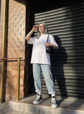 DAXUEN white oversized solid vintage graphic tee — model photo