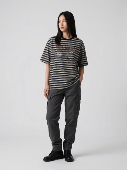 DAXUEN Striped crewneck T-shirt with distressed text print — model photo