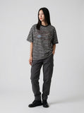 DAXUEN Striped crewneck T-shirt with distressed text print — model photo