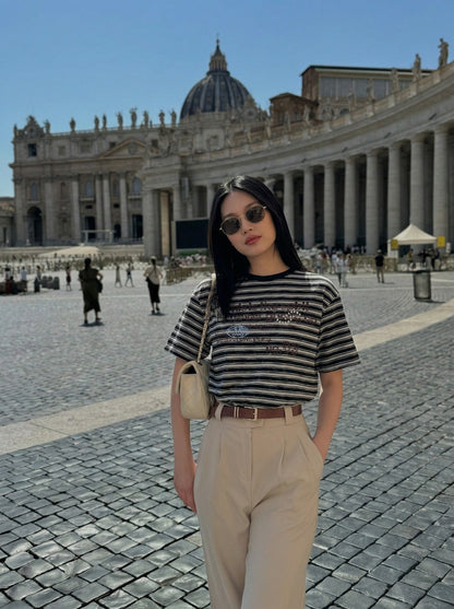 DAXUEN Striped crewneck T-shirt with distressed text print — model photo