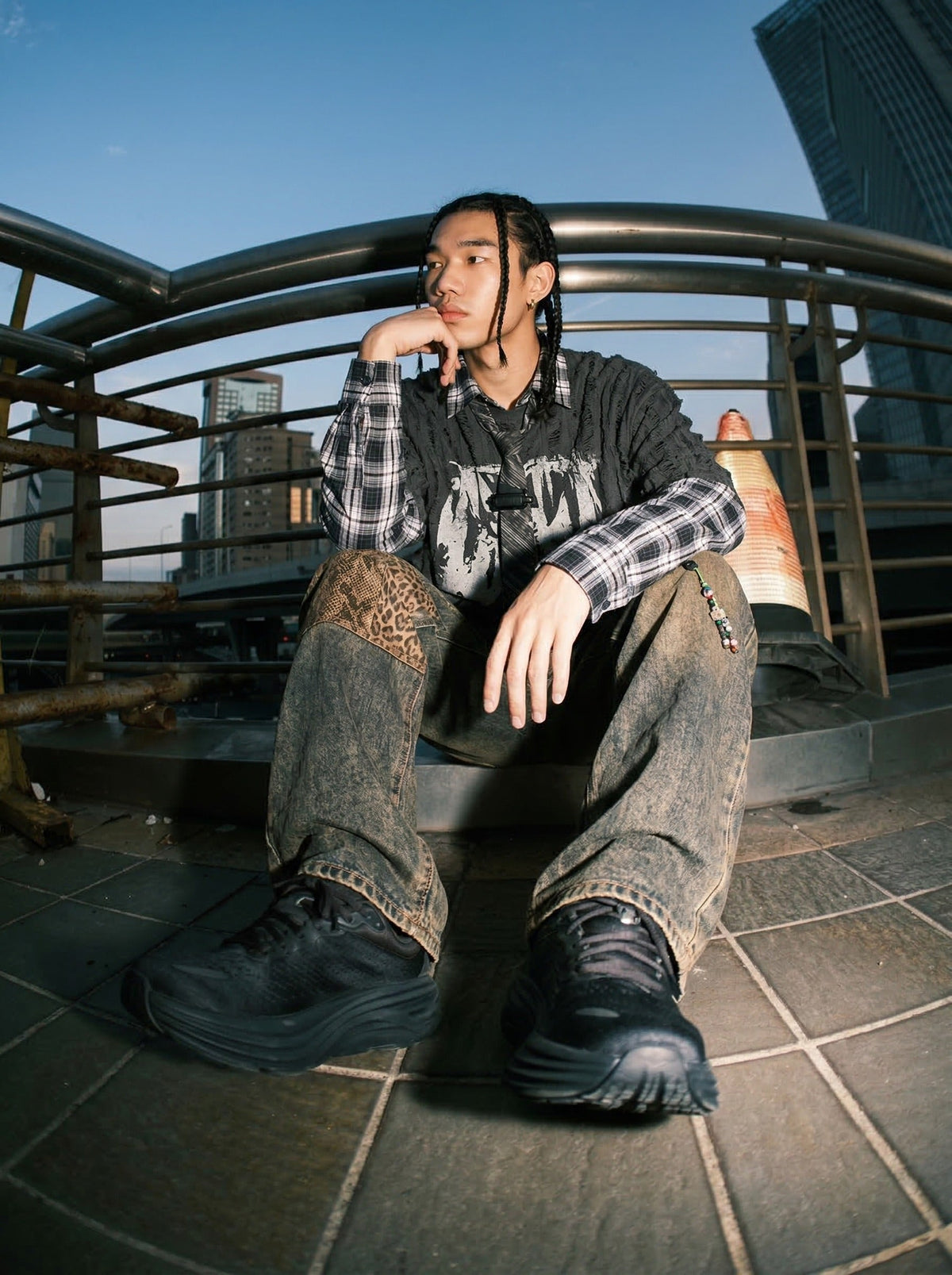 Grunge graphic long-sleeve shirt with plaid details — model photo