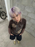 Layered long-sleeve polo shirt with bear graphic — model photo