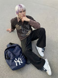 Layered long-sleeve polo shirt with bear graphic — model photo