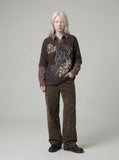 Layered long-sleeve polo shirt with bear graphic — model photo