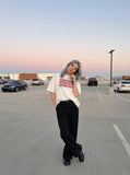 DAXUEN white oversized stacked text graphic tee — model photo