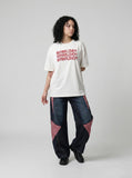 DAXUEN white oversized stacked text graphic tee — model photo