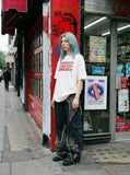 DAXUEN white oversized stacked text graphic tee — model photo