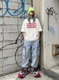 DAXUEN white oversized stacked text graphic tee — model photo