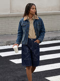 DAXUEN Dark blue denim shorts with white stitching and star designs — model photo