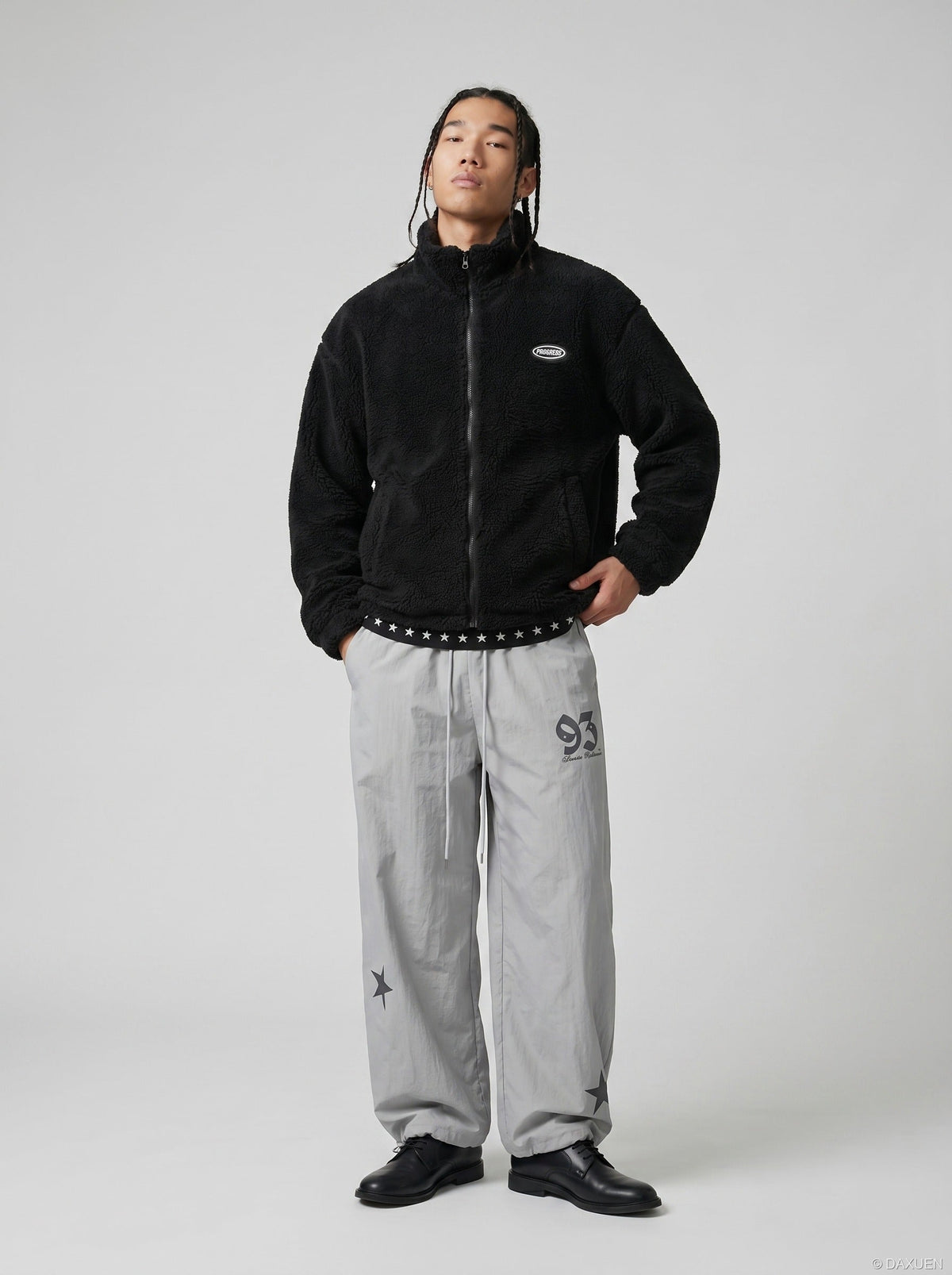 DAXUEN Wide-leg track pants with star graphics — model photo