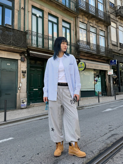DAXUEN Wide-leg track pants with star graphics — model photo
