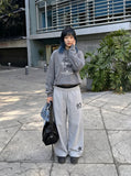 DAXUEN Wide-leg track pants with star graphics — model photo
