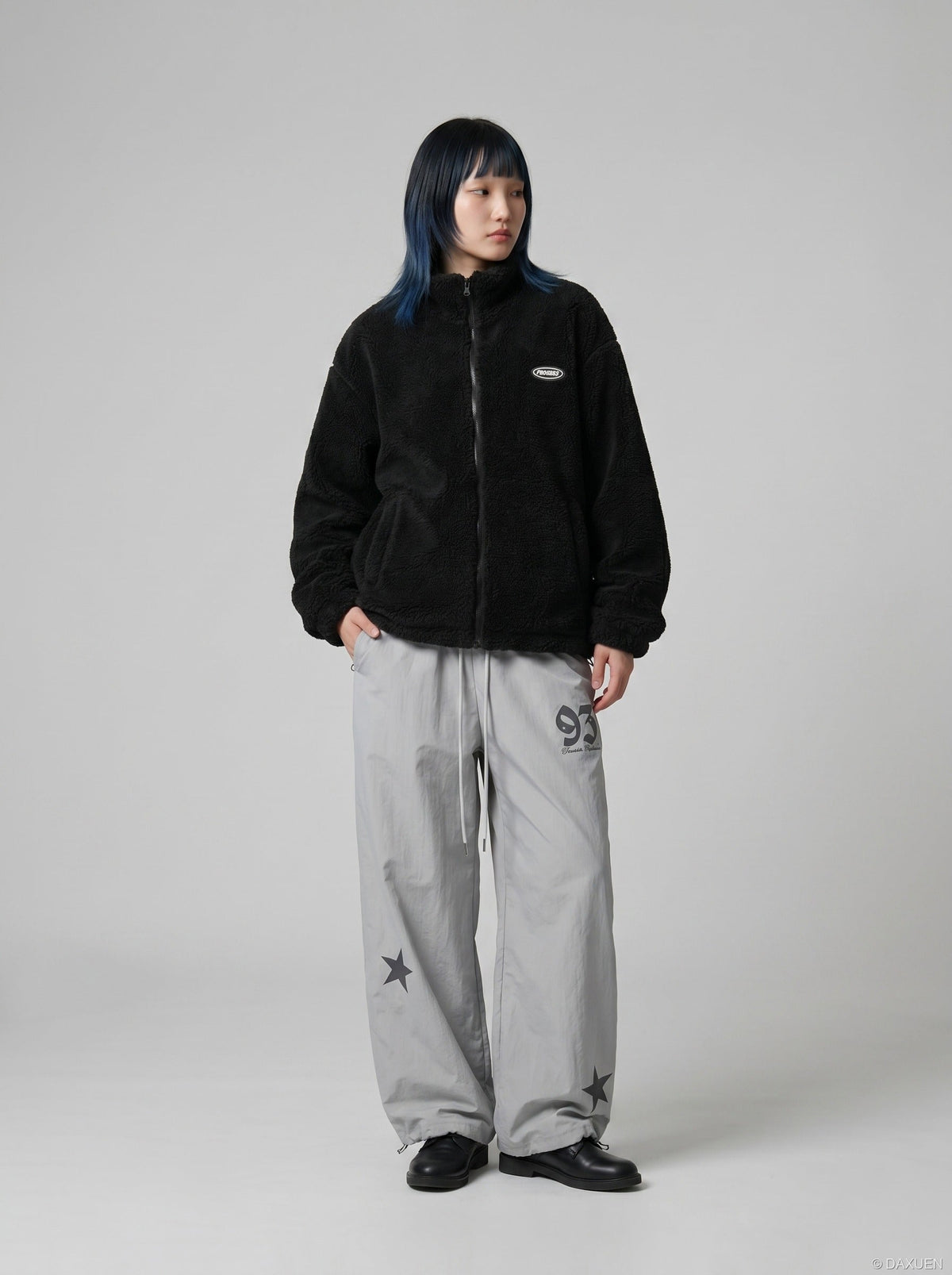 DAXUEN Wide-leg track pants with star graphics — model photo