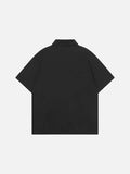 Short-sleeved collared shirt with star appliqués