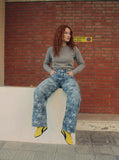 DAXUEN Wide-leg denim jeans with star print and distressed details — model photo