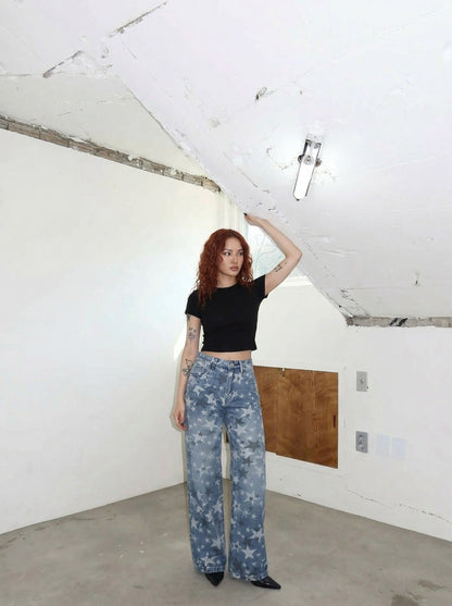 DAXUEN Wide-leg denim jeans with star print and distressed details — model photo