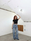 DAXUEN Wide-leg denim jeans with star print and distressed details — model photo
