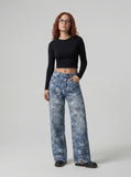 DAXUEN Wide-leg denim jeans with star print and distressed details — model photo
