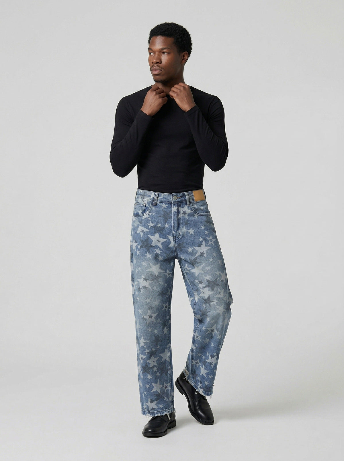 DAXUEN Wide-leg denim jeans with star print and distressed details — model photo