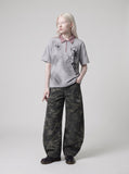 DAXUEN dark grey starburst graphic polo shirt — model photo