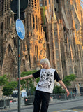 DAXUEN Layered top featuring graphic print vest over t-shirt — model photo