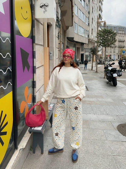 DAXUEN Cream wide-leg pants with star print and embroidery — model photo