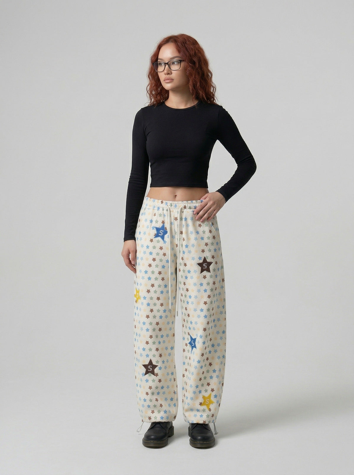 DAXUEN Cream wide-leg pants with star print and embroidery — model photo