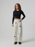 DAXUEN Cream wide-leg pants with star print and embroidery — model photo