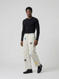 DAXUEN Cream wide-leg pants with star print and embroidery — model photo