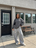 DAXUEN black oversized striped long-sleeve tee — model photo