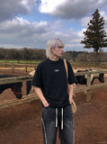 DAXUEN Studded abstract logo short-sleeved t-shirt — model photo