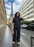 DAXUEN Oversized t-shirt with studded details and abstract logo — model photo