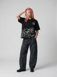 DAXUEN Short-sleeved polo shirt with embroidered logo and script print — model photo