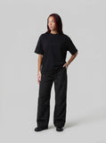 DAXUEN black oversized stylized chest graphic T-shirt — model photo