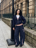 DAXUEN navy blue wide-leg cargo pants with pink accents — model photo