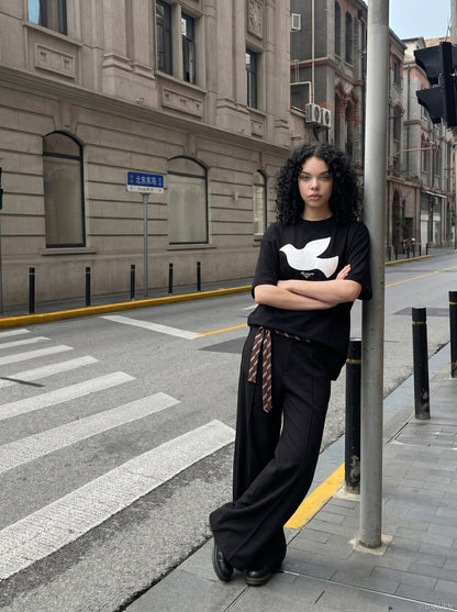DAXUEN white oversized stylized dove graphic t-shirt — model photo