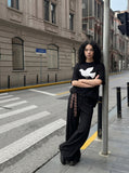 DAXUEN white oversized stylized dove graphic t-shirt — model photo