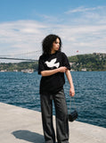 DAXUEN white oversized stylized dove graphic t-shirt — model photo