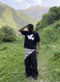 DAXUEN white oversized stylized dove graphic t-shirt — model photo